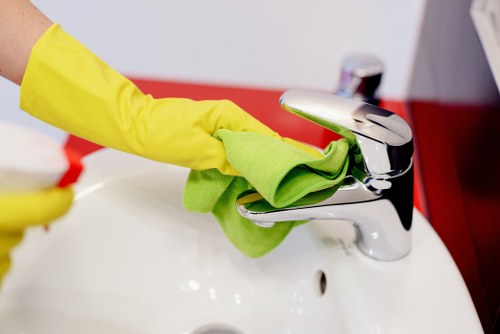 Cleaner reviewing hazards and safe product use during a carpet cleaning job