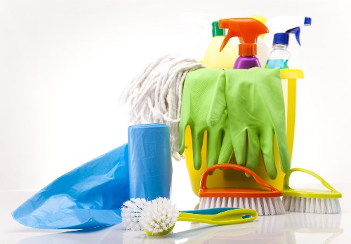 Upholstery cleaning equipment used on a sofa